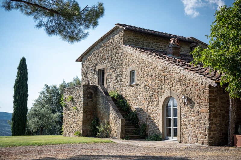 Tuscan farmhouse with cypress tree