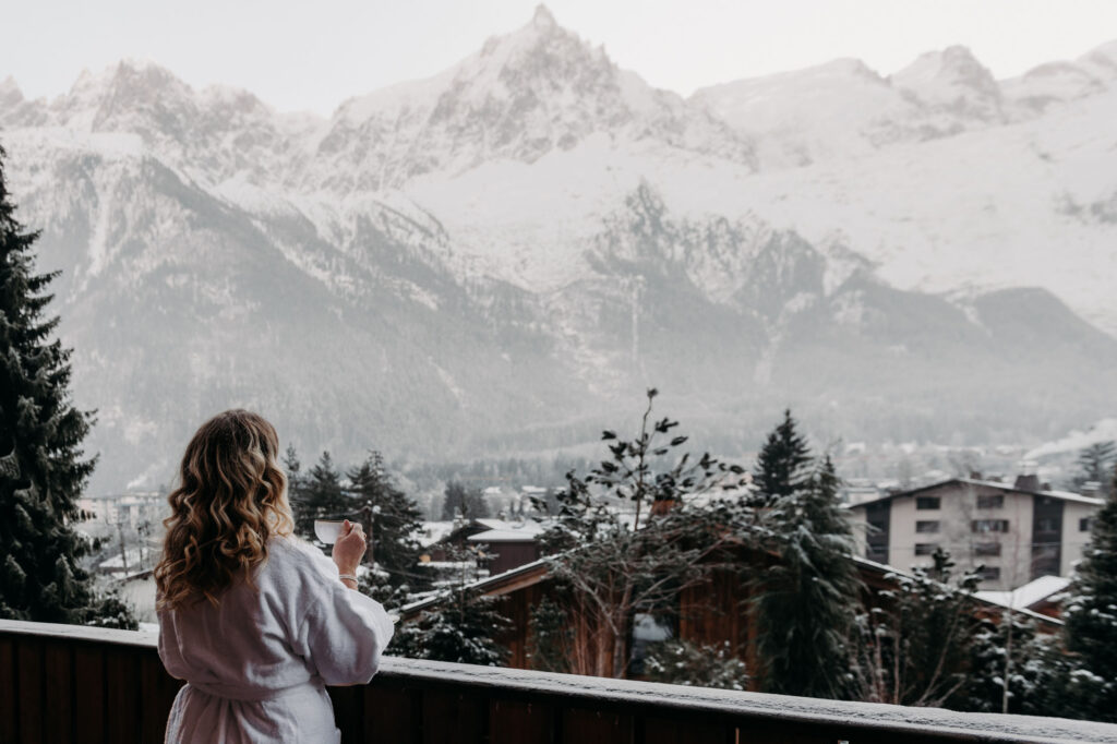 lady looking towards Mont Blanc from luxury chalet
